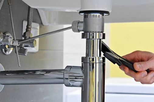 PS-welcome image Plumber Fixing a Sink in Bathroom