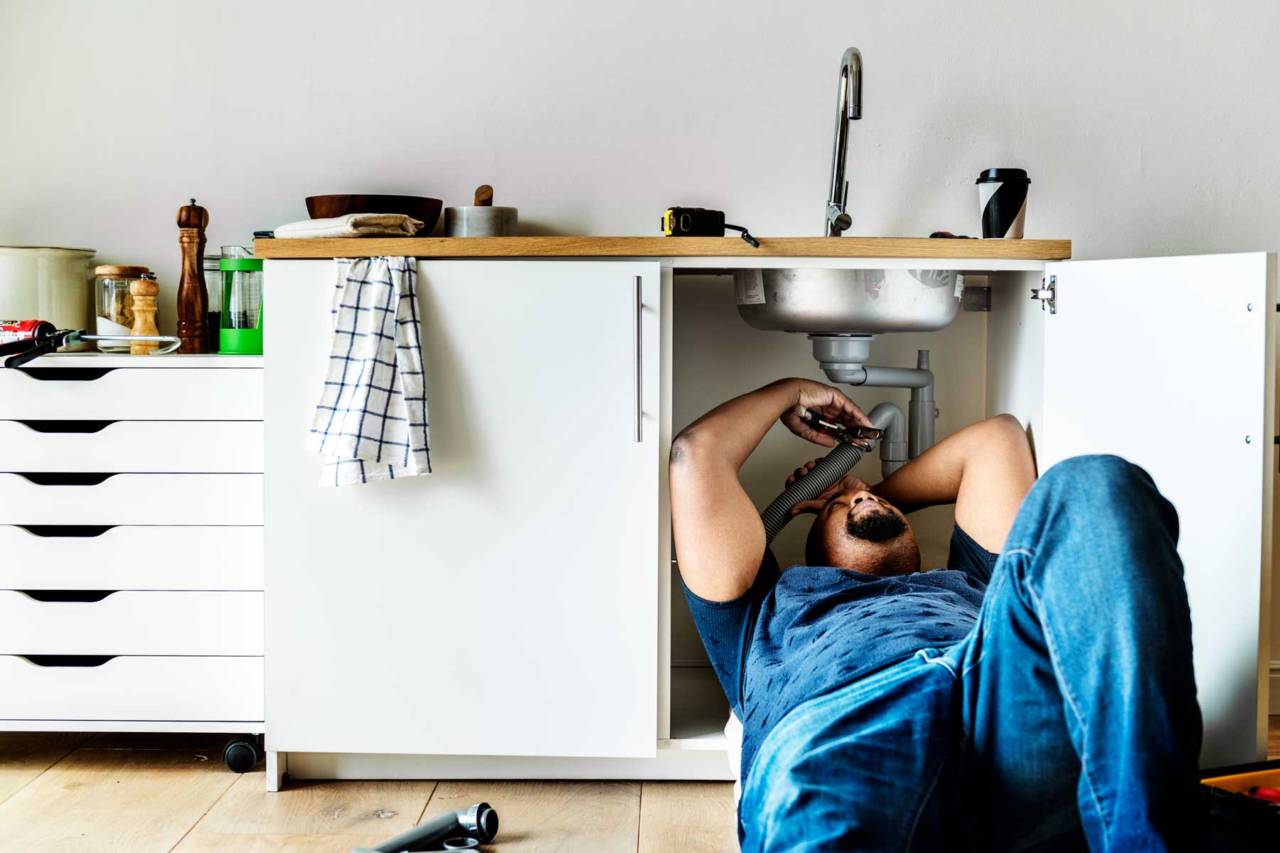 plumber-man-fixing-kitchen-sink image